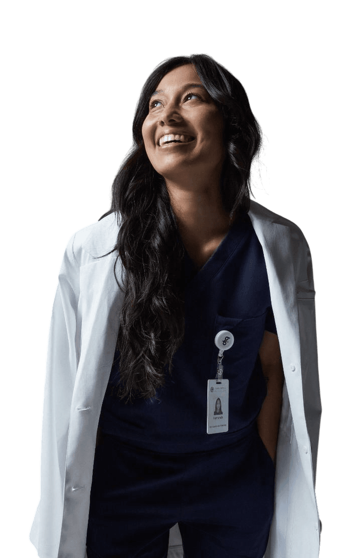 A smiling physician wearing a white coat